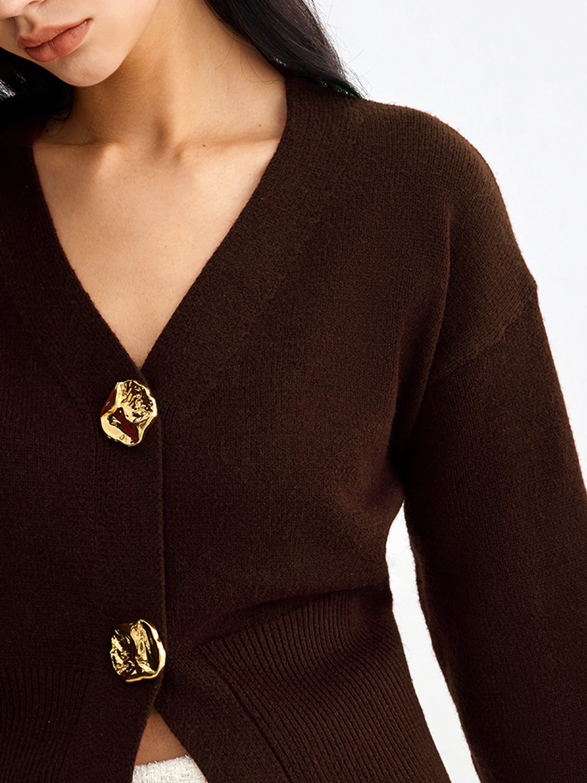 Gilet court en maille boutons métalliques femme